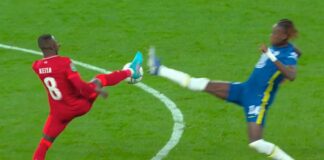 Naby Keita stretches for the ball with Chelsea's Trevoh Calobah