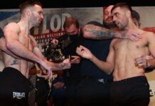 Caterall grabs Taylor’s throat in a foul face JOSH TAYLOR v JACK CATTERALL 25-2-2022.SSE HYDRO,.GLASGOW.PIC LAWRENCE LUSTIG.IBF/WBC/WBA/WBO SUPER-LIGHTWEIGHT CHAMPIONSHIP OF THE WORLD.JOSH TAYLOR V JACK CATTERALL WEIGH IN