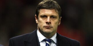 Dynamo Kiev manager Oleg Luzhny walks to the dugout before his team took on Manchester United in their UEFA Champions League football match at Old Trafford, Manchester, north west England, 07 November 2007. AFP PHOTO/ANDREW YATES (Photo credit should read ANDREW YATES/AFP via Getty Images)