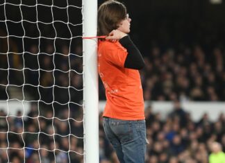 A person has been arrested after tying himself to posting throughout Everton and Newcastle A protestor ties himself to a goal post during Everton vs Newcastle