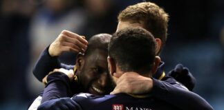 Afobe double leads Millwall to victory over Huddersfield

