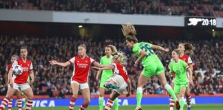 Tabia Wassmuth of VFL Wolfsburg scores his team's first goal against Arsenal
