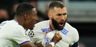 Real Madrid's David Alaba celebrates Karim Benzema, who scored his team's first goal