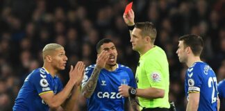 Referee Craig Pawson sends off Allan