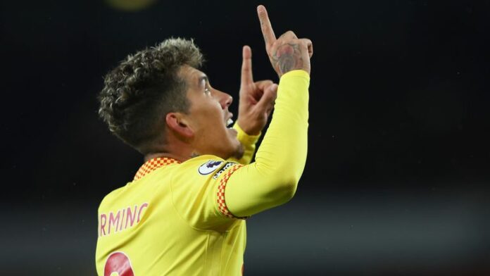 Roberto Firmino celebrates after his brilliant finish put Liverpool 2-0 ahead at Arsenal