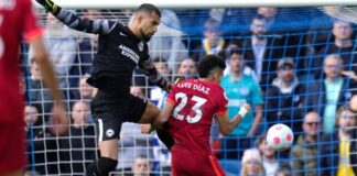 Luis Diaz bumps into Brighton goalkeeper Robert Sanchez as he puts Liverpool ahead at AMEX