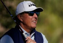 Mickelson sits outdoors the gamers; DeChambeau within the discipline Mickelson sits outside the players; DeChambeau in the field