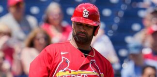 Pujols started with his mind on wife's brain surgery

