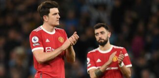 Man Utd's Harry Maguire and Bruno Fernandes react to their defeat against Man City