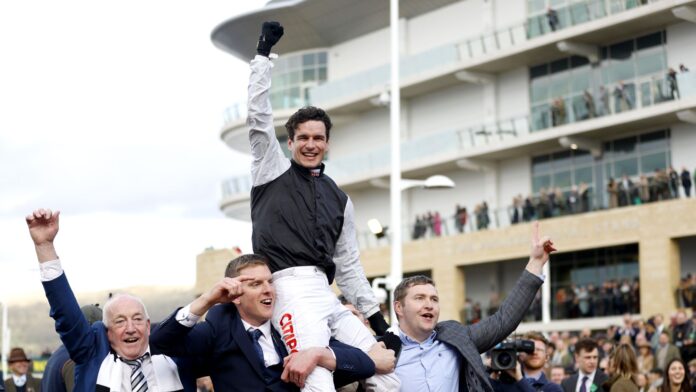 The-elaborate-Mullins-sees-Flooring-Porter-defending-the-Stayers-crown.jpg Danny Mullins is lifted around the Cheltenham parade ring by Flooring Porter's owners after winning the Stayers' Hurdle
