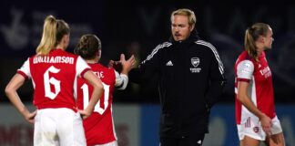 Arsenal head coach Jonas Eidevall greets Kim Little