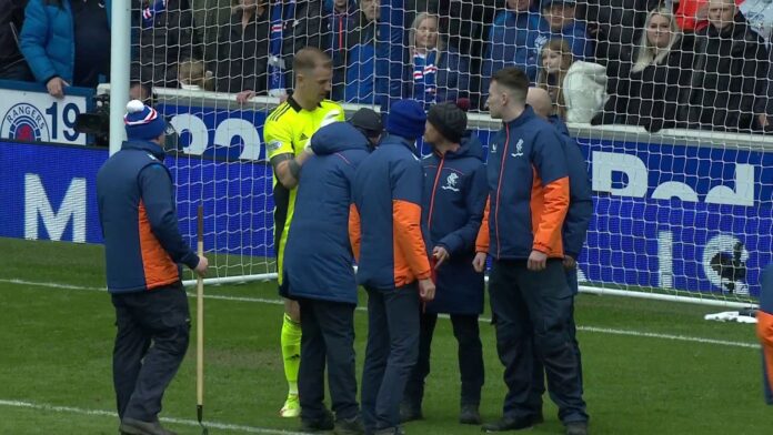 The-clash-of-ancient-powers-stopped-after-a-glass-bottle.jpg Stewards helped clear the penalty area after Joe Hart alerted referee Willie Collum