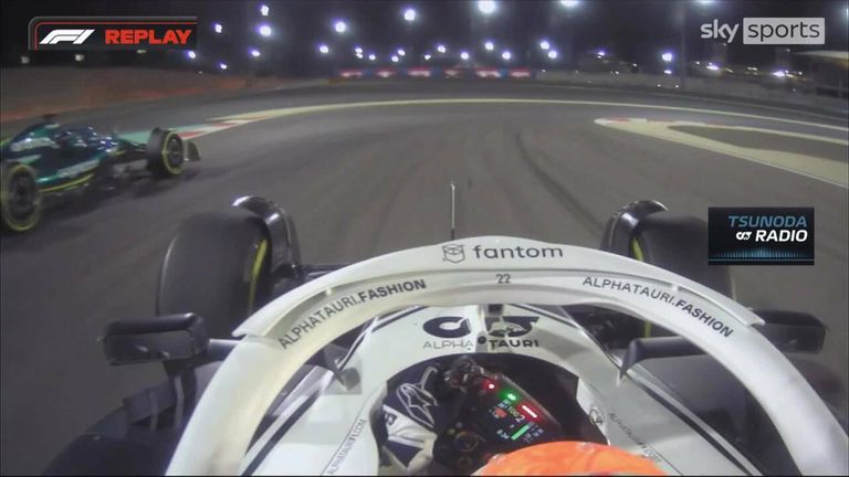 Yuki Tsundo cuts Lance Stroll's car around a corner at the Bahrain Grand Prix. 
