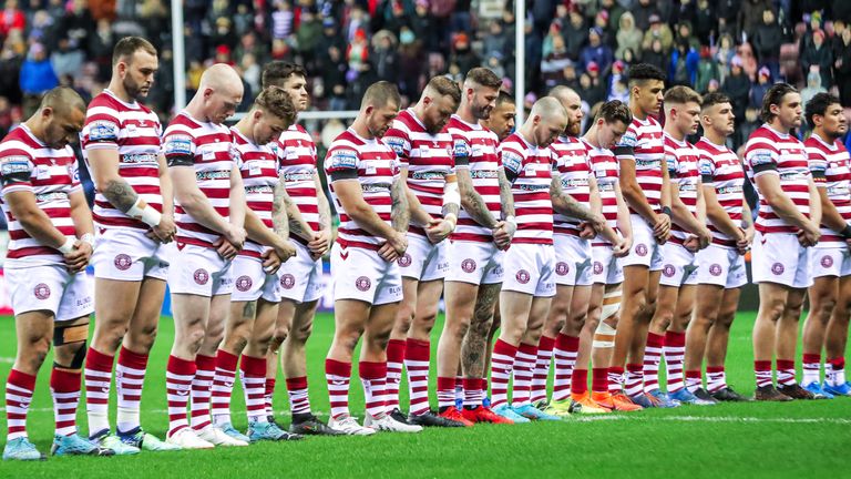 Wigan players observed a minute's silence in memory of former player Faiga Tugamala