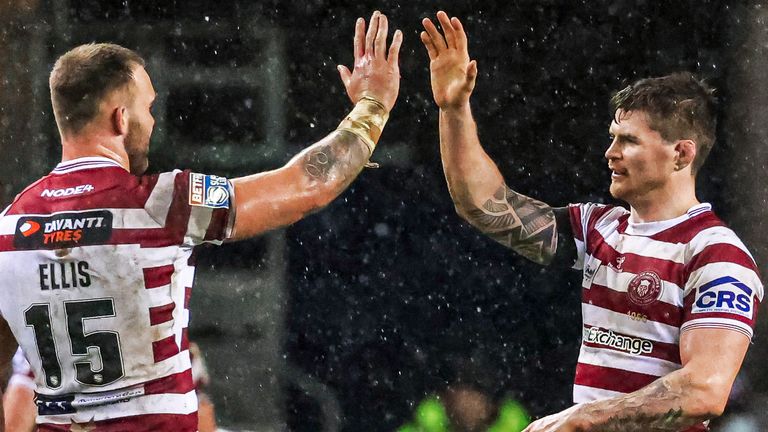 Wigan duo John Bateman (right) and Cade Ellis celebrate their victory