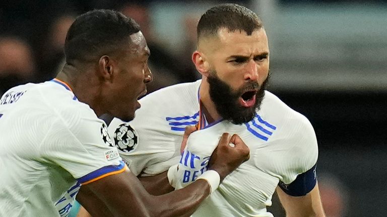 Real Madrid's David Alaba celebrates Karim Benzema, who scored his team's first goal