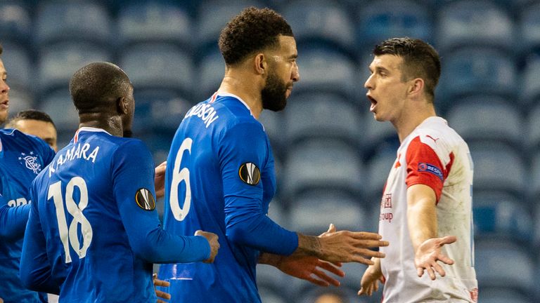Rangers'  Conor Goldson (left) and Glenn Camara object to something Ondrei Kudela Slavia said