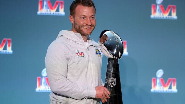 Head coach Sean McVeigh of the Los Angeles Rams poses with the Vince Lombardi Trophy during the Super Bowl LVI press conference and MVP press conference at the Los Angeles Convention Center on February 14, 2023 in Los Angeles, California.
