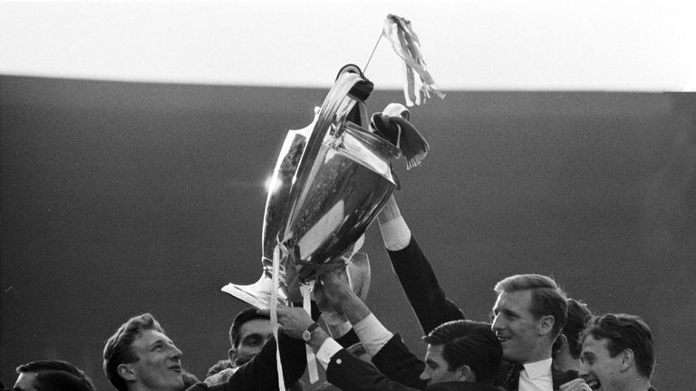 Cheerful Celtic players show off the 1967 European Cup to their fans.