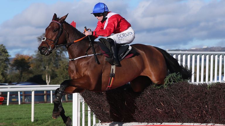 Envoi Allen ridden by jockey Rachael Blackmore jumps the last fence on their way to winning at Down Royal