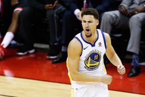 Klay Thompson on a court: Klay Thompson #11 of the Golden State Warriors reacts in the fourth quarter of Game Seven of the Western Conference Finals of the 2018 NBA Playoffs against the Houston Rockets at Toyota Center on May 28, 2018 in Houston, Texas. Bob Levey/Getty Images