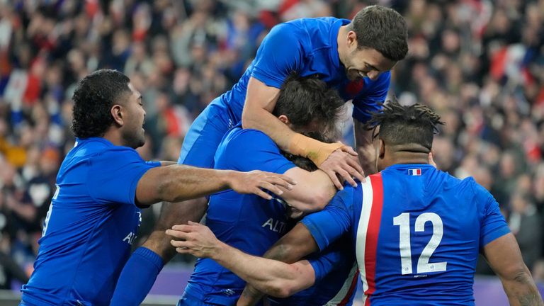 France players celebrate after Antoine Dupont scored his team's third attempt