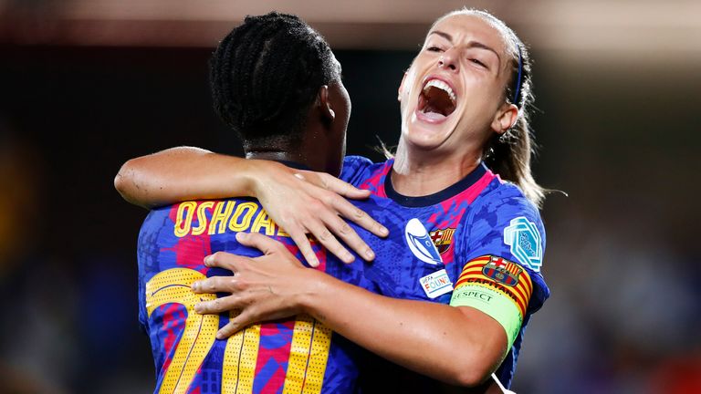 Alexia Putilas celebrates with Assisat Oshoala after scoring Barcelona's second goal against Arsenal