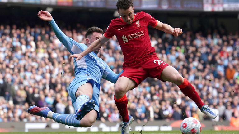 Aymeric Laporte (left) and Manchester City vie for the ball