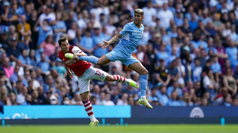 Cedric (left) and Arsenal had a tough time against Manchester City in August