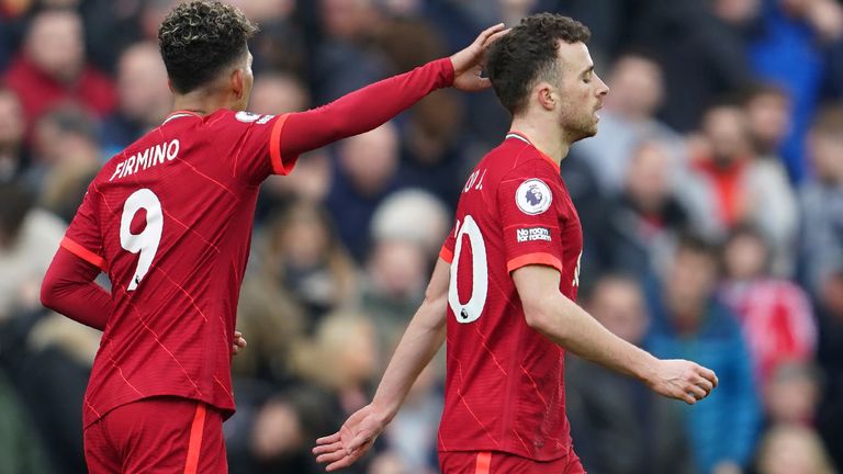 Roberto Firmino congratulates Diogo Jota after scoring (AP)