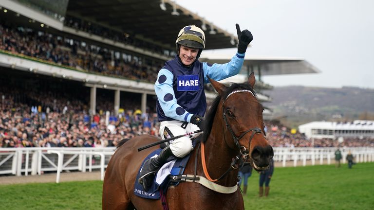 Tom Cannon salutes the cameras after his first Cheltenham win over Edwards at Arkell