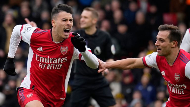 Gabriel Martinelli celebrates with his Arsenal teammates after scoring his team's third goal (AP)