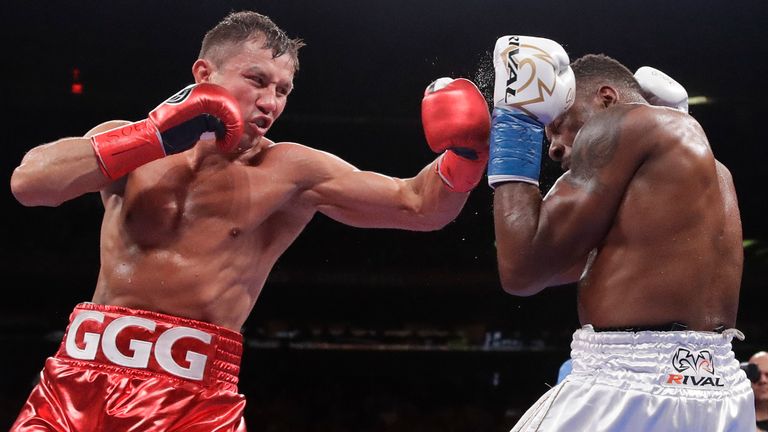 Kazakhstan... Gennady Golovkin, left, punches Canada... Steve Rolls during the fourth round of his middleweight boxing match on Saturday, June 8, 2019, in New York.  Golovkin stopped out for Rolls in the fourth round.  (AP Photo/Frank Franklin II)