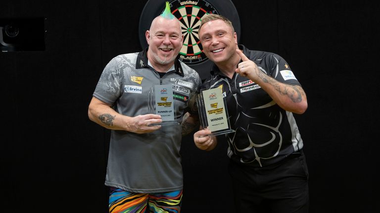 Peter Wright (left) will now have to wait until next weekend's UK Open for his next chance to become world number one.