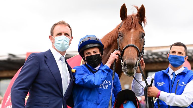 Hurricane Lane with coach Charlie Appleby and jockey William Buick after the success of the Irish derby