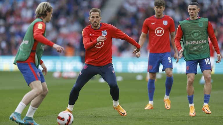 Stones (second from the right) pulled out of the warm-up period in England's friendly win over Switzerland