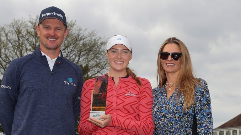 Georgina Blackman (center) pictured with Justin Rose (left) and Kate Rose (right) after winning an event at the Women's Pink Series