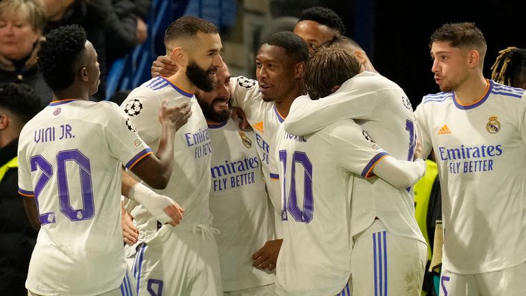 Karim Benzema celebrates scoring a hat-trick against Chelsea