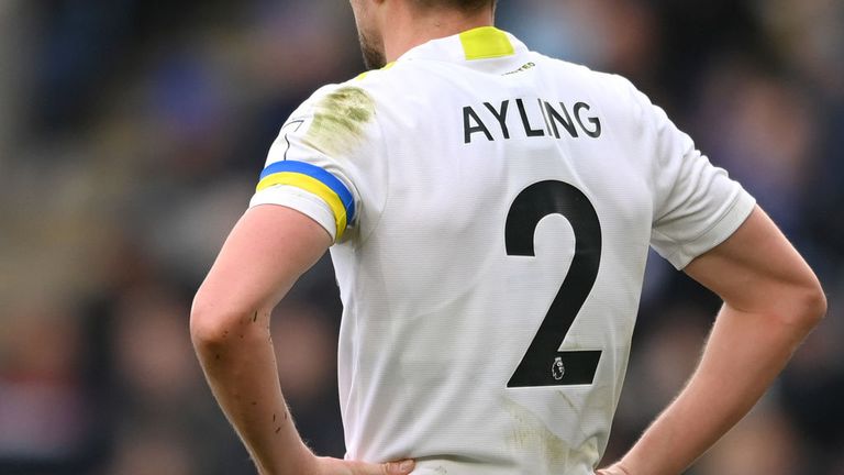 Luke Ayling wore a blue and yellow striped bracelet