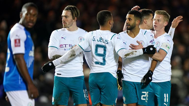 Riyad Mahrez celebrates his goal against Peterborough with his Manchester City teammates