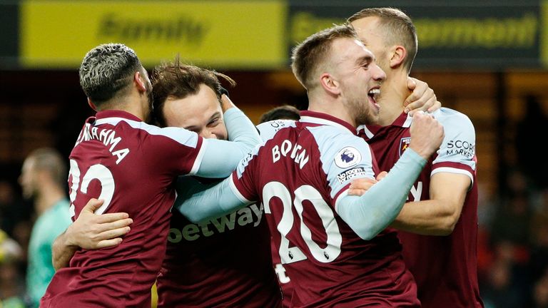 Mark Noble celebrates with his teammates after scoring West Ham's third goal (AP)
