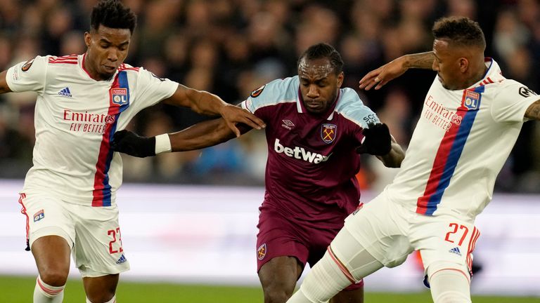 Michael Antonio challenges Jerome Boateng, right, and Thiago Mendes during West Ham's match against Lyon