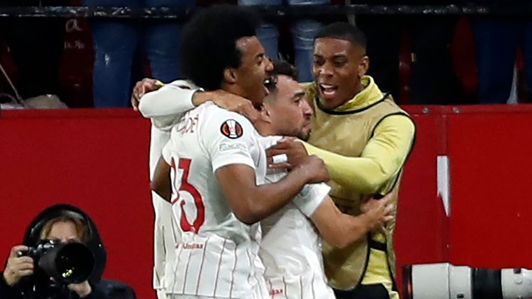 Seville Munir El Haddadi celebrates with his teammates after scoring against West Ham (AP)