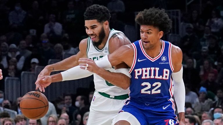 Philadelphia 76ers guard Mattis Thieball (22) shoots the ball off Boston Celtics forward Jason Tatum (0) during the first half of an NBA basketball game, Wednesday, Dec. 1, 2023, in Boston.  (AP Photo/Charles Krupa)