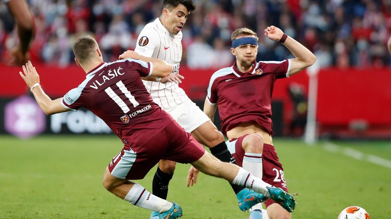 West Ham's Nikola Vlasic and Tomas Suchek battle for the ball with Sevilla's Marcos Acuna (AP)