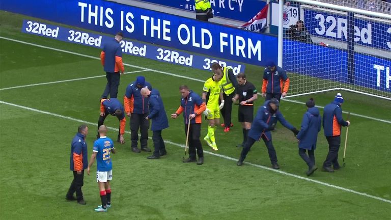 Rangers striker Kemar Rof helped the field referees clear Hart's penalty area.