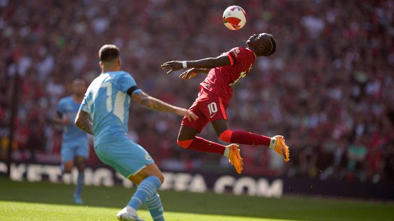 Sadio Mane controls the ball as Joao Cancelo looks at it (AP)
