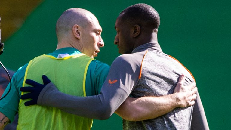 Celtic captain Scott Brown (left) embracing the Rangers'  Glenn Camara before the game during the Scottish Premier League match between Celtic and Rangers at Celtic Park