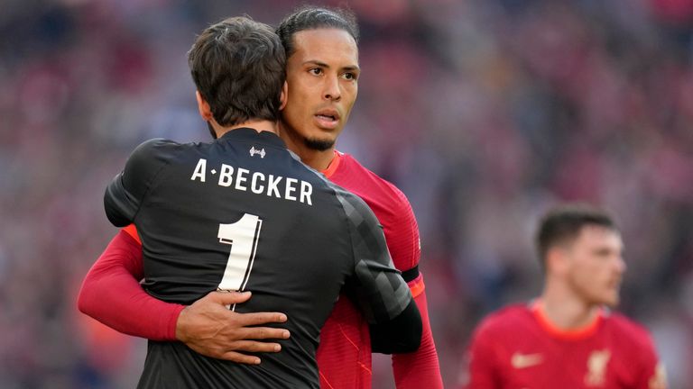 Liverpool, Virgil van Dijk and Alisson, left, celebrate full time