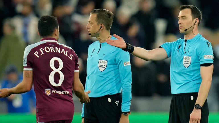 West Ham's Pablo Fornals argues with the referees during the UEFA Europa League quarter-final first leg match between West Ham United and Olympique Lyonnais at the London Stadium in London on Thursday, April 7, 2023 (AP Photo/Kirsty Wigglesworth)